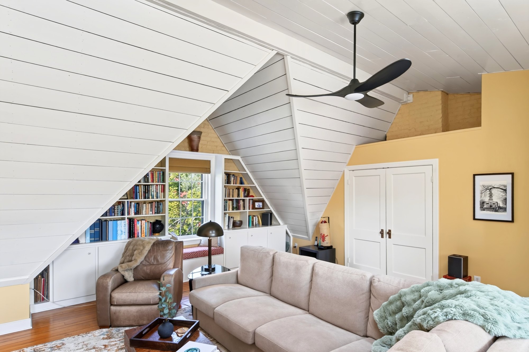 Top-floor room with vaulted ceiling and built-in shelving, A Modern Take on the Fan, Richmond, Virginia